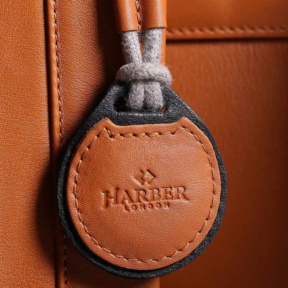 Leather AirTag sleeve designed to track your luggage