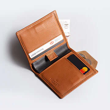 Open leather wallet with cards and coins inside, RFID protected